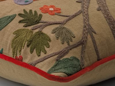Vibrant woodland embroidery cushion