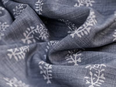 White botanical motif on soft blue