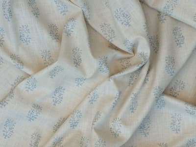 Blue botanical sprigs on ivory