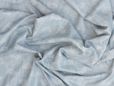 White botanical motif on soft blue