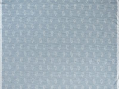 White botanical motif on soft blue