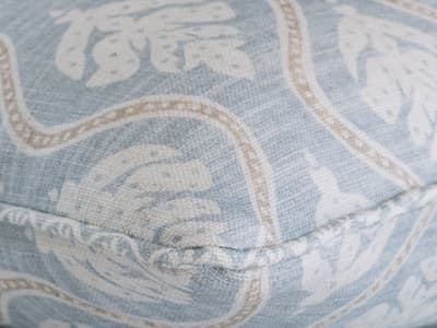 Leaf motif cushion in soft blue