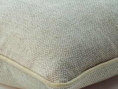 Cushion with a two-tone weave