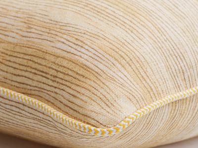 Cushion in mellow yellow brush marks