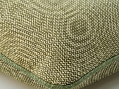 Cushion in a spring green weave