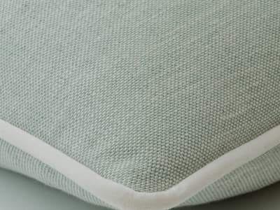 Cushion in soft washed blue