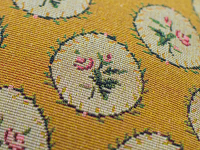 Floral cushion in yellow
