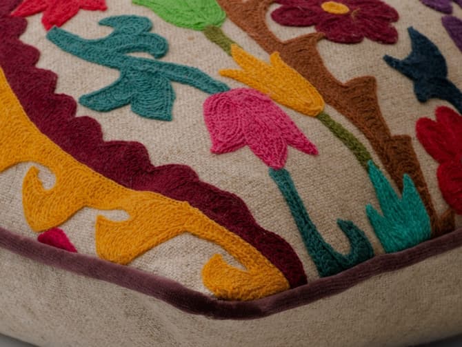 Vibrant floral embroidery cushion