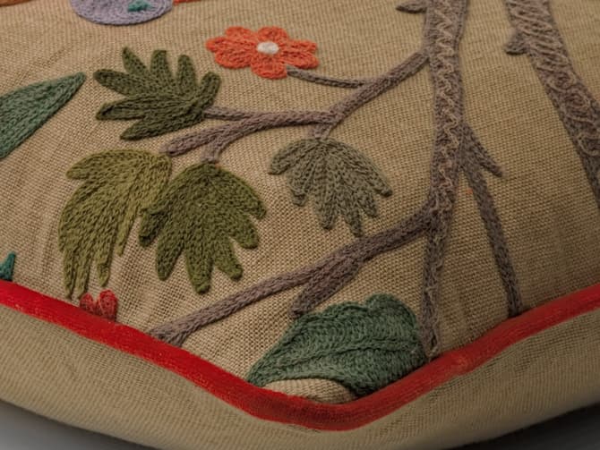 Vibrant woodland embroidery cushion