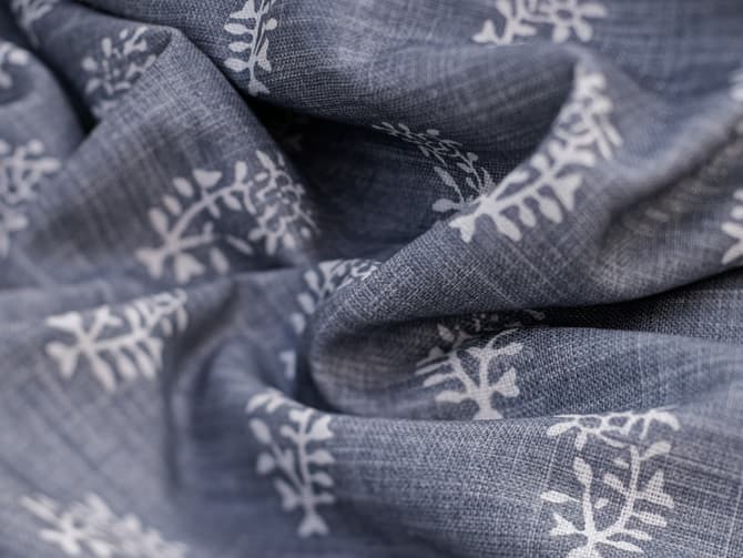 White botanical motif on soft blue
