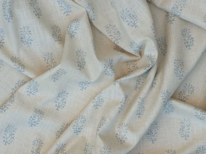 Blue botanical sprigs on ivory