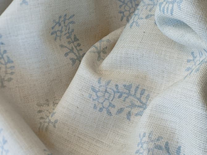 Blue botanical sprigs on ivory
