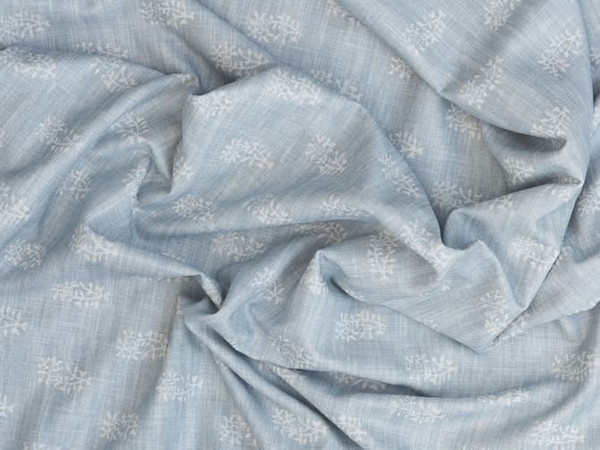 White botanical motif on soft blue