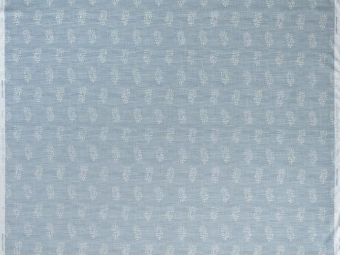 White botanical motif on soft blue