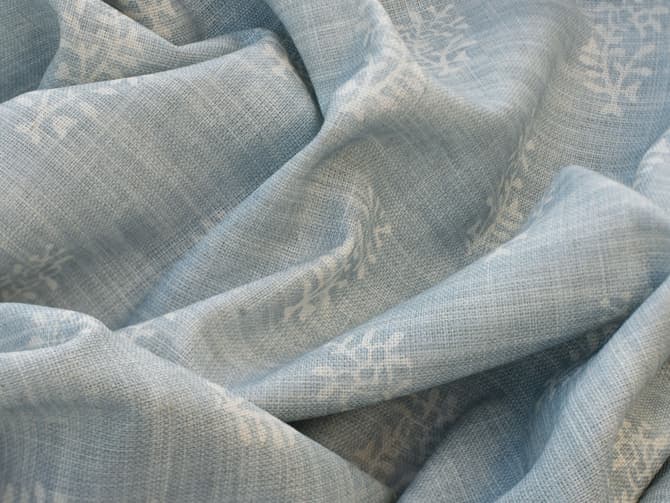 White botanical motif on soft blue