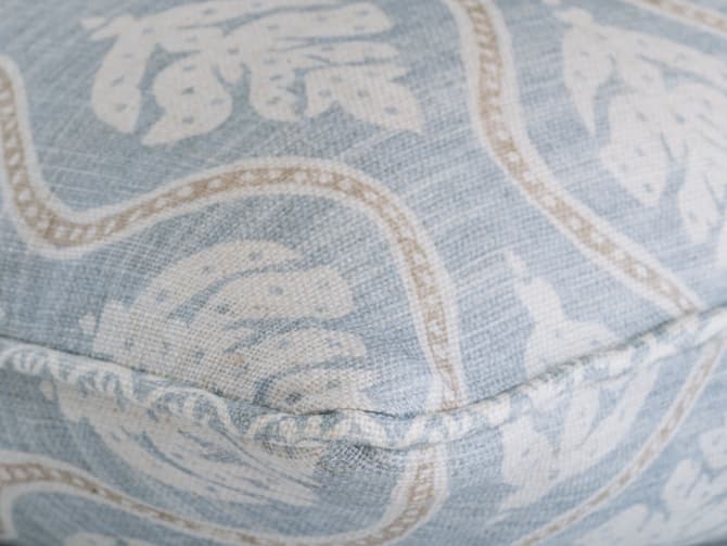 Leaf motif cushion in soft blue