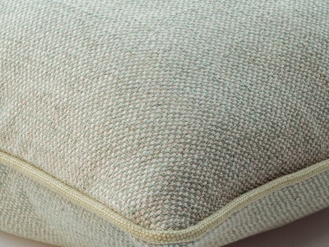 Cushion with a two-tone weave