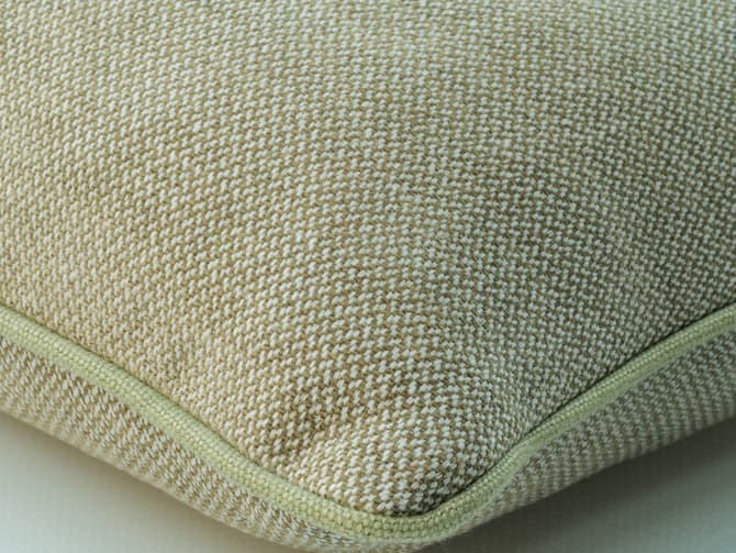 Cushion in muted pistachio weave