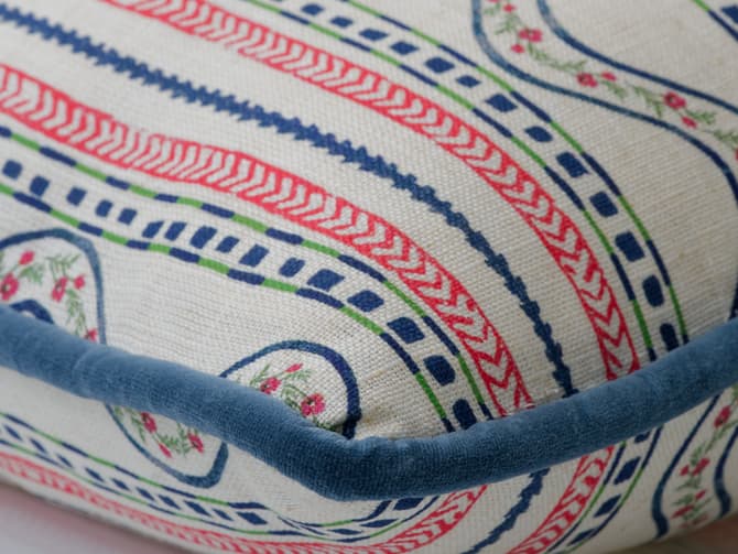 A cushion of bright stripes with folkloric flair