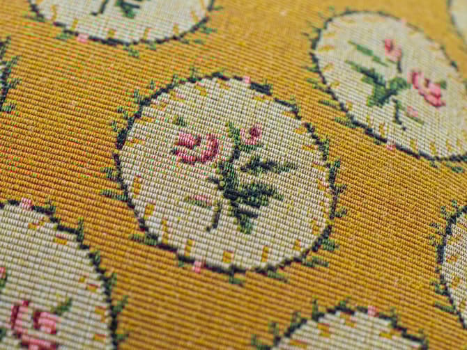 Floral cushion in yellow