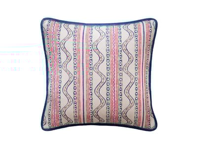 A cushion of bright stripes with folkloric flair