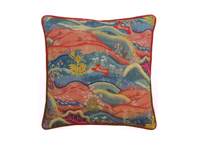 Vibrant embroidered landscape cushion