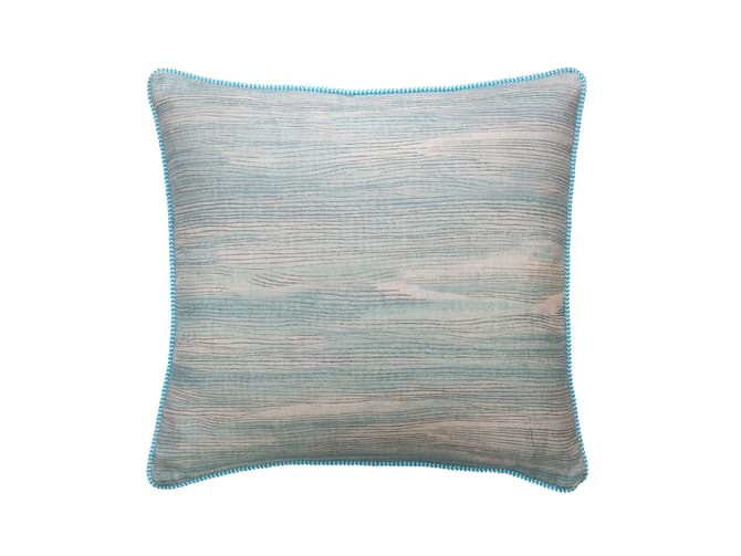 Cushion in soft blue brush marks